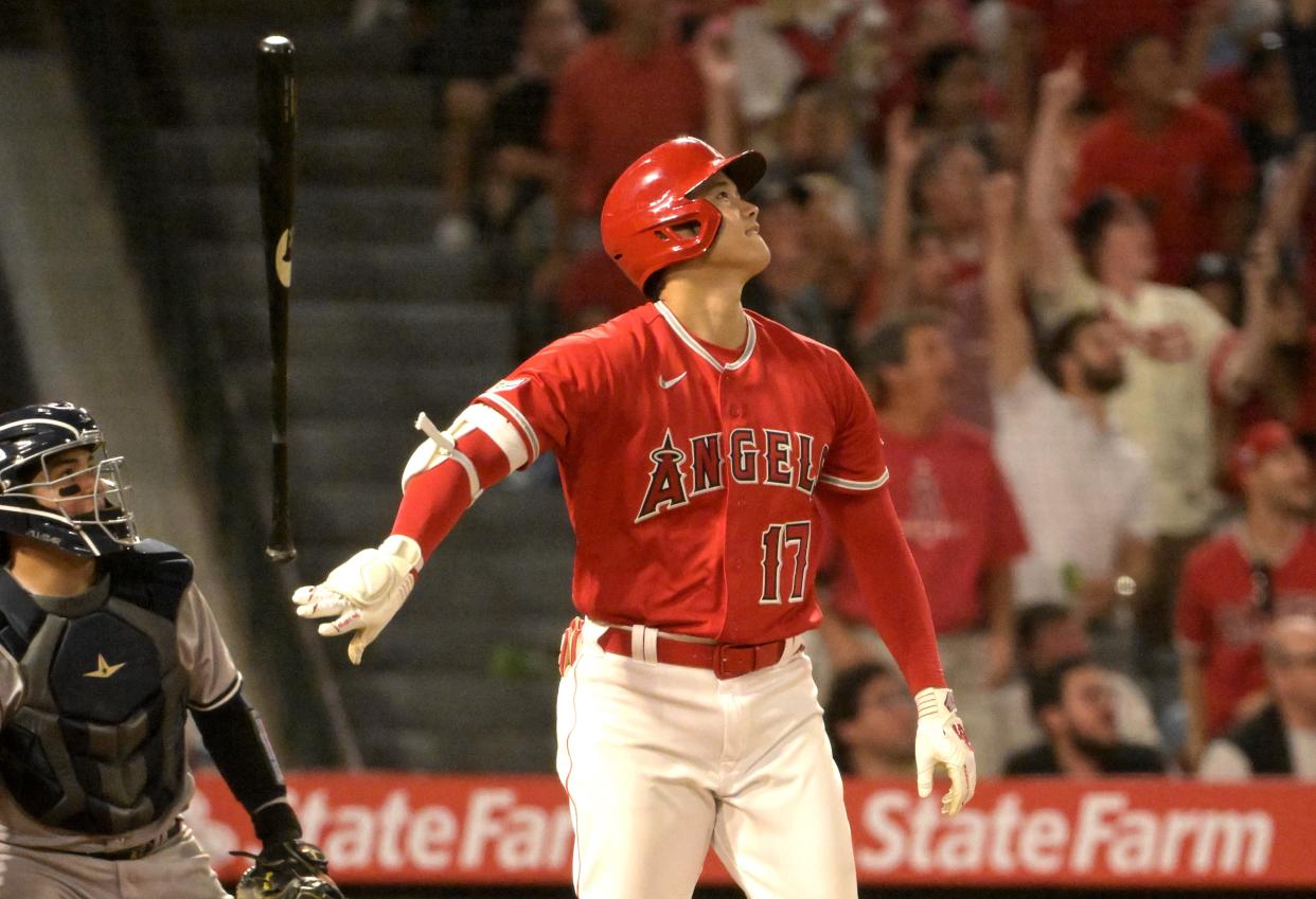 Jul 17, 2023; Anaheim, California, USA;  Los Angeles Angels designated hitter Shohei Ohtani (17) flips his bat after hitting a two-run home run in the seventh inning against the New York Yankees at Angel Stadium. Mandatory Credit: Jayne Kamin-Oncea-USA TODAY Sports