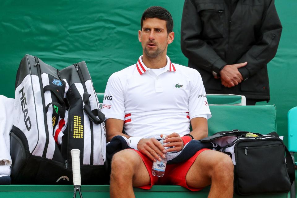 Novak Djokovic (pictured) sits between games during his third round singles match against Daniel Evans.