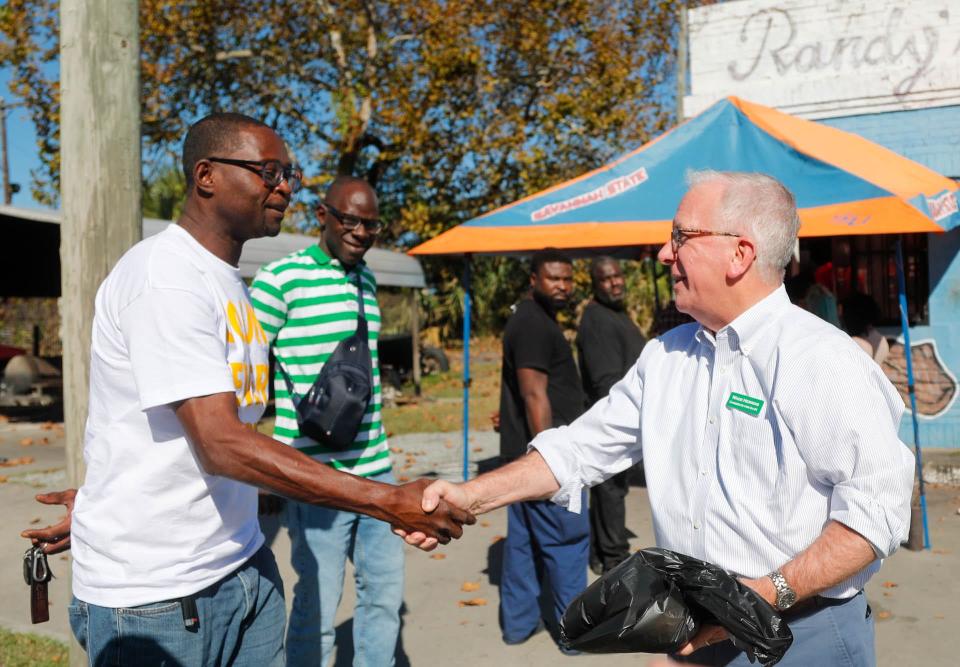 U.S. House of Representatives candidate Wade Herring talks with voters on Tuesday November 8, 2022 while in line at Randy's Bar B Q in Savannah.