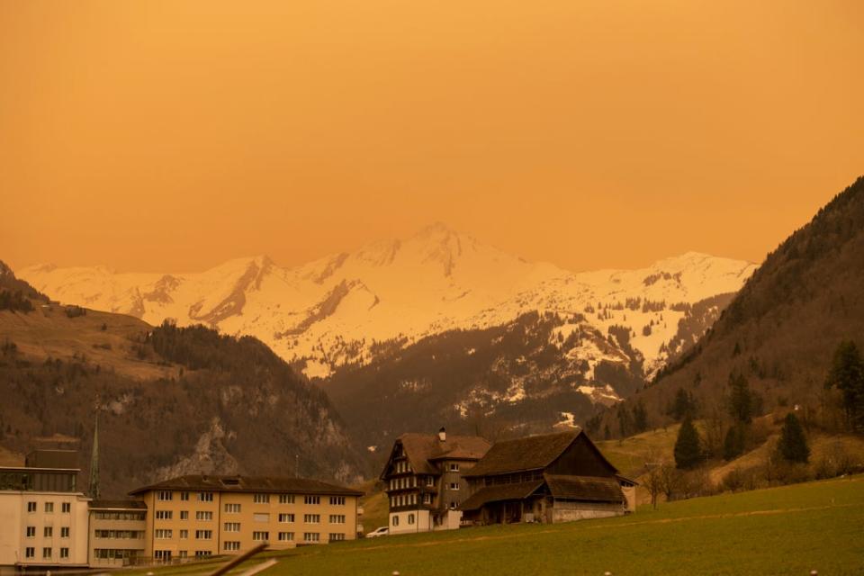 Sahara dust drifts over central Switzerland near Mount Brisen and the village of Stans in the canton of Nidwalden, Switzerland (AP)