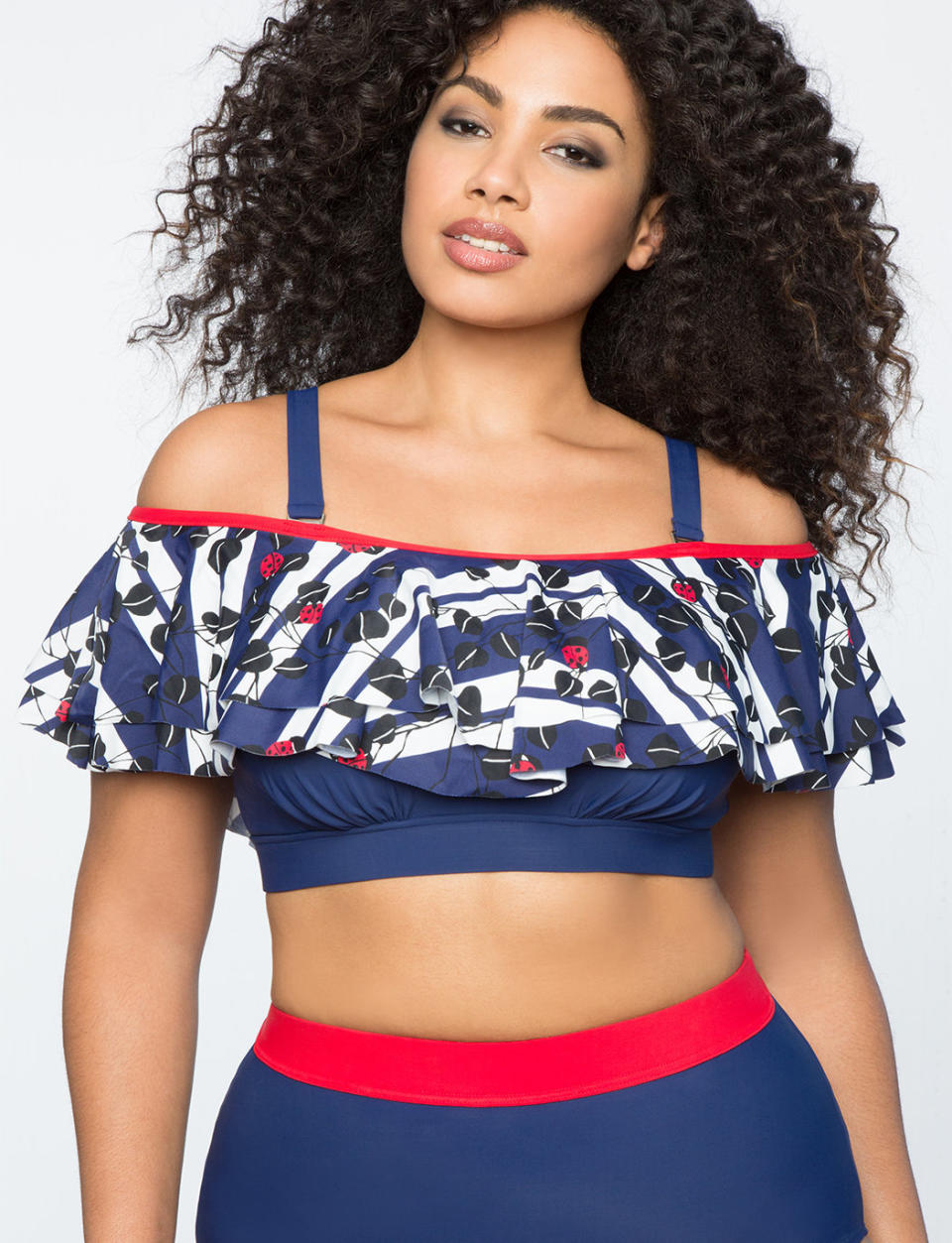 Get the suit <a href="http://www.eloquii.com/off-the-shoulder-ruffle-bikini-top/1645737.html?q=off%20the%20shoulder%20swimsuit&amp;dwvar_1645737_colorCode=32&amp;start=50" target="_blank">here</a>.
