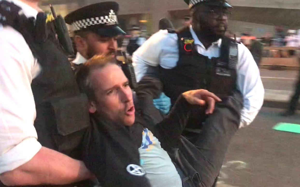 Olympic gold medallist Etienne Stott was arrested by police at the Extinction Rebellion demonstration on Waterloo Bridge - PA