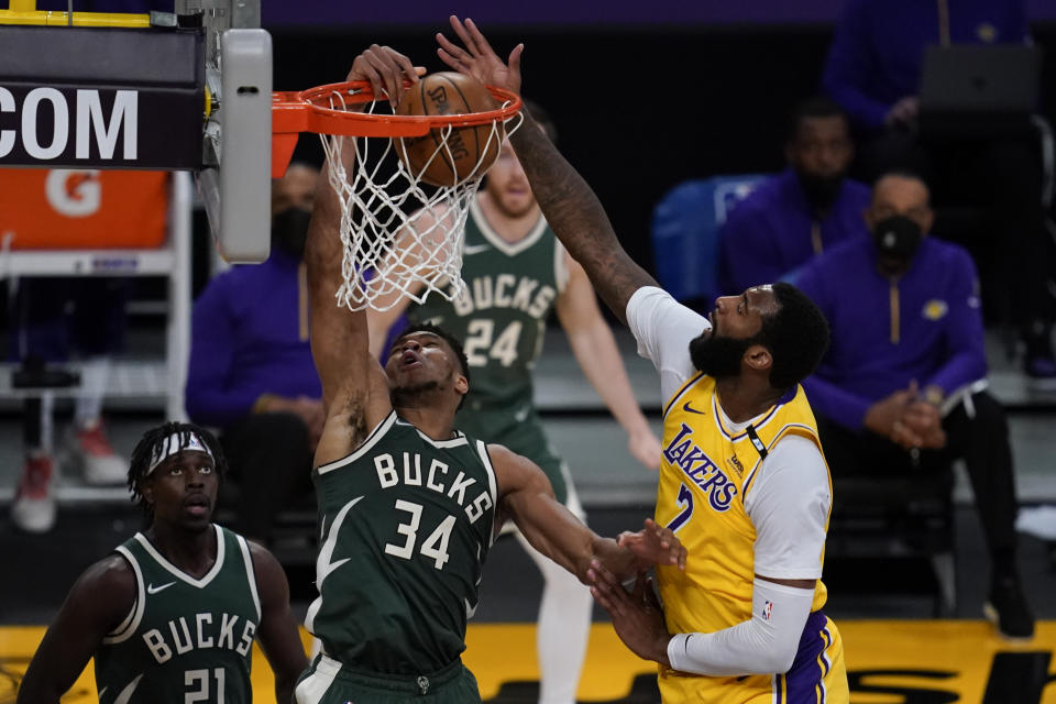 Milwaukee Bucks forward Giannis Antetokounmpo (34) dunks against Los Angeles Lakers center Andre Drummond (2) during the second quarter of an NBA basketball game Wednesday, March 31, 2021, in Los Angeles. (AP Photo/Ashley Landis)