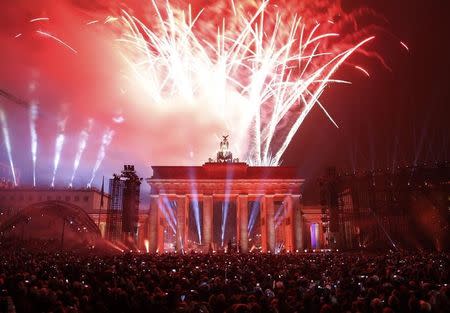 Fireworks explode above the Brandenburg Gate in Berlin November 9, 2014, during celebrations to mark the 25th anniversary of the fall of the Berlin Wall. REUTERS/Fabrizio Bensch