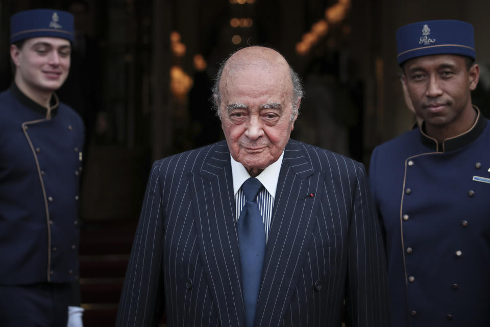 FILE - Egyptian businessman and Ritz hotel owner Mohamed Al Fayed poses with his hotel staff in Paris, June 27, 2016. Al Fayed, the former Harrods owner whose son Dodi was killed in a car crash with Princess Diana, has died at age 94. His death was announced Friday, Sept. 1, 2023, by Fulham Football Club, which Al Fayed once owned. (AP Photo/Kamil Zihnioglu, File)