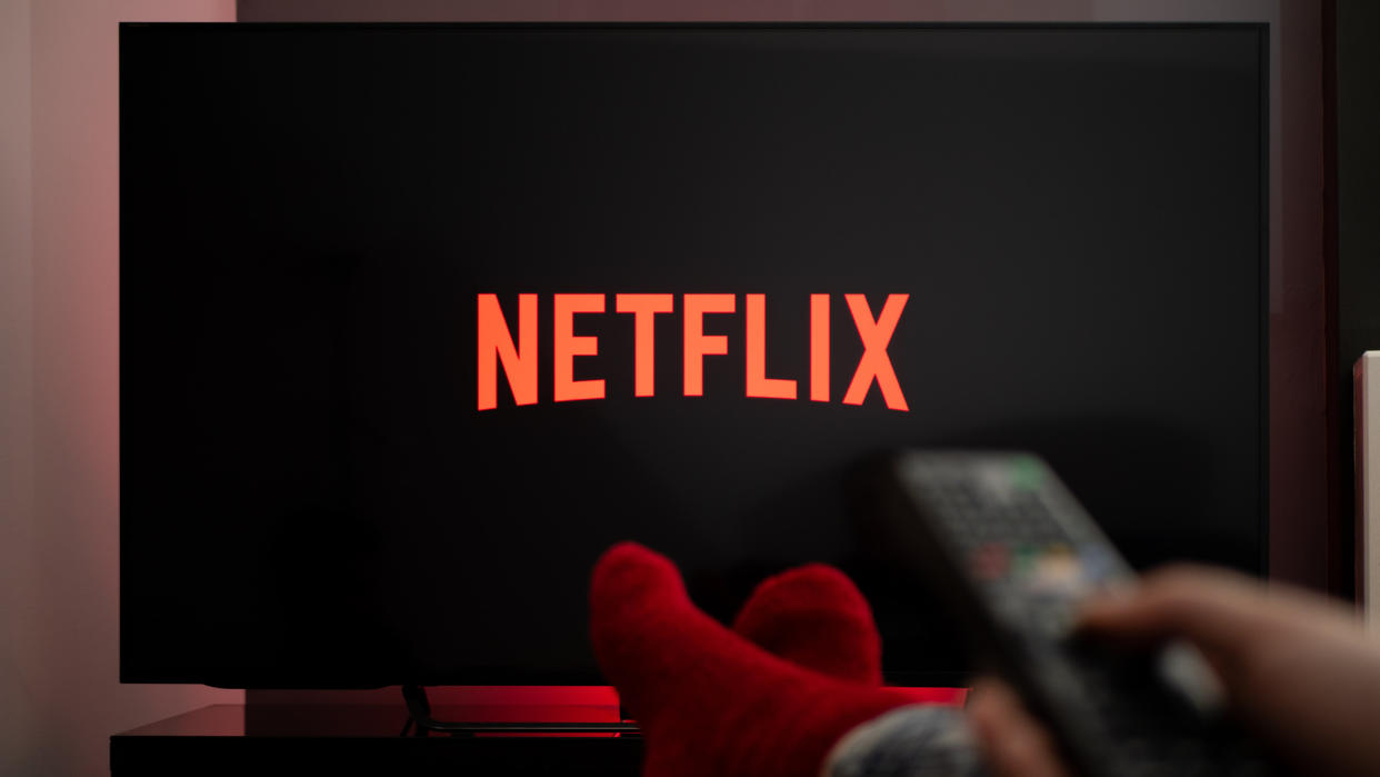  Man watching Netflix on TV 