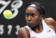 Cori "Coco" Gauff of the U.S. makes a backhand return to Romania's Sorana Cirstea during their second round singles match at the Australian Open tennis championship in Melbourne, Australia, Wednesday, Jan. 22, 2020. (AP Photo/Lee Jin-man)