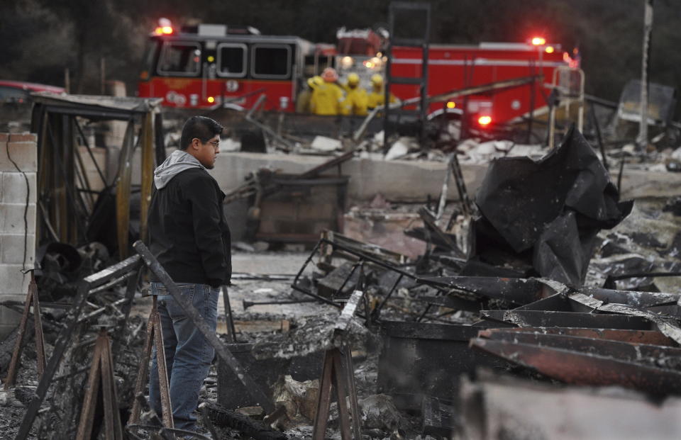 <p>Ricky Alvarado looks over the charred remains of his home at the Seminole Springs Mobile Home Park, Sunday, Nov. 11, 2018, after the neighborhood was devastated by wildfires in Agoura Hills, Calif.<br>(Photo from Chris Pizzello, AP) </p>