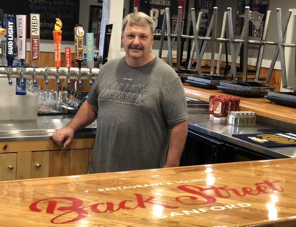 Paul Pelletier is seen here on July 11, 2023, at the bar of Back Street Sanford, the restaurant he owned and operated for five years. Pelletier is retiring and selling the popular spot on School Street in Sanford, Maine.