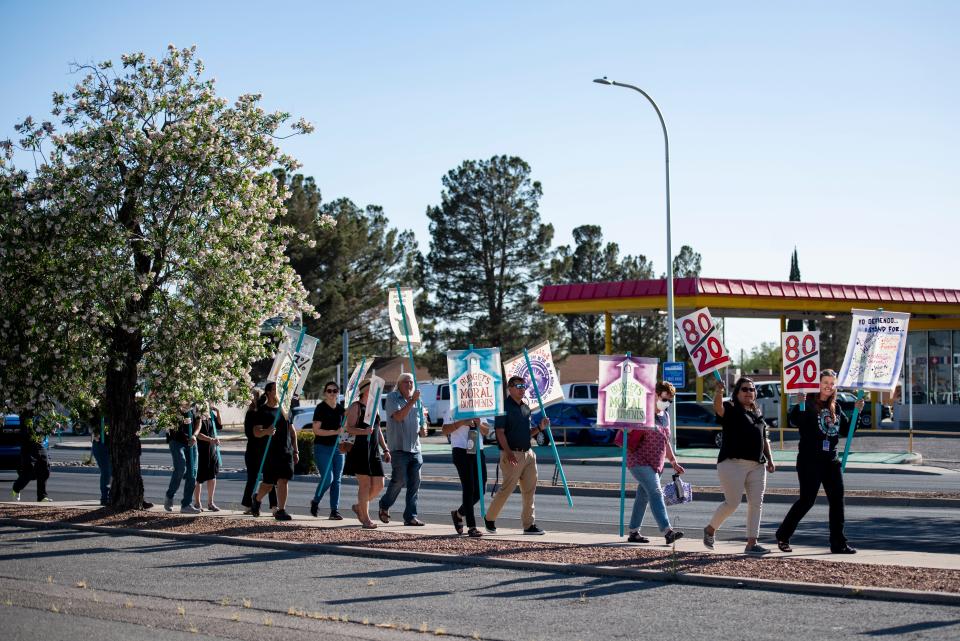 Las Cruces Public School staff and community members protest along Main Street to voice their concerns with LCPS Board of Education on Tuesday, May 17, 2022. Their concerns included classroom size, pay equity and budget practices. 