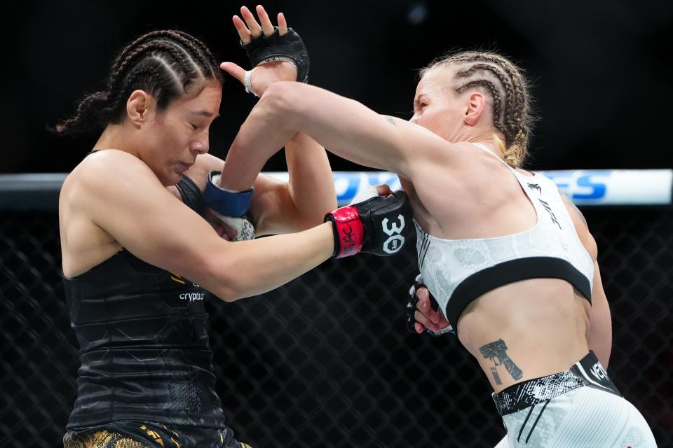 Sep 16, 2023; Las Vegas, Nevada, USA; Alexa Grasso (red gloves) fights Valentina Shevchenko (blue gloves) during UFC Fight Night at T-Mobile Arena. Mandatory Credit: Stephen R. Sylvanie-USA TODAY Sports