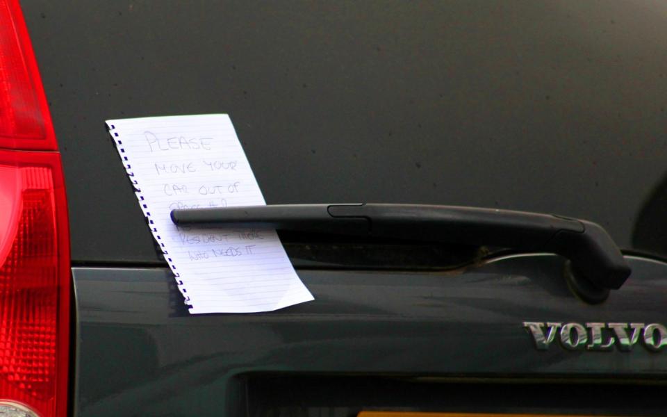 A note on the Volvo parked outside the block at the centre of the dispute in Hampstead  - Credit: Paul Keogh