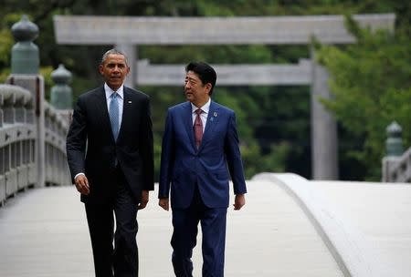 U.S. President Barack Obama (L) talks with Japanese Prime Minister Shinzo Abe on Ujibashi bridge as they visit Ise Grand Shrine in Ise, Mie prefecture, Japan, May 26, 2016, ahead of the first session of the G7 summit meetings. REUTERS/Toru Hanai