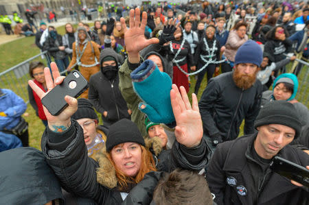 Protesters block members of the press as they chain themselves to an entry point prior at the inauguration of U.S. President-elect Donald Trump in Washington, DC, U.S., January 20, 2017. REUTERS/Bryan Woolston