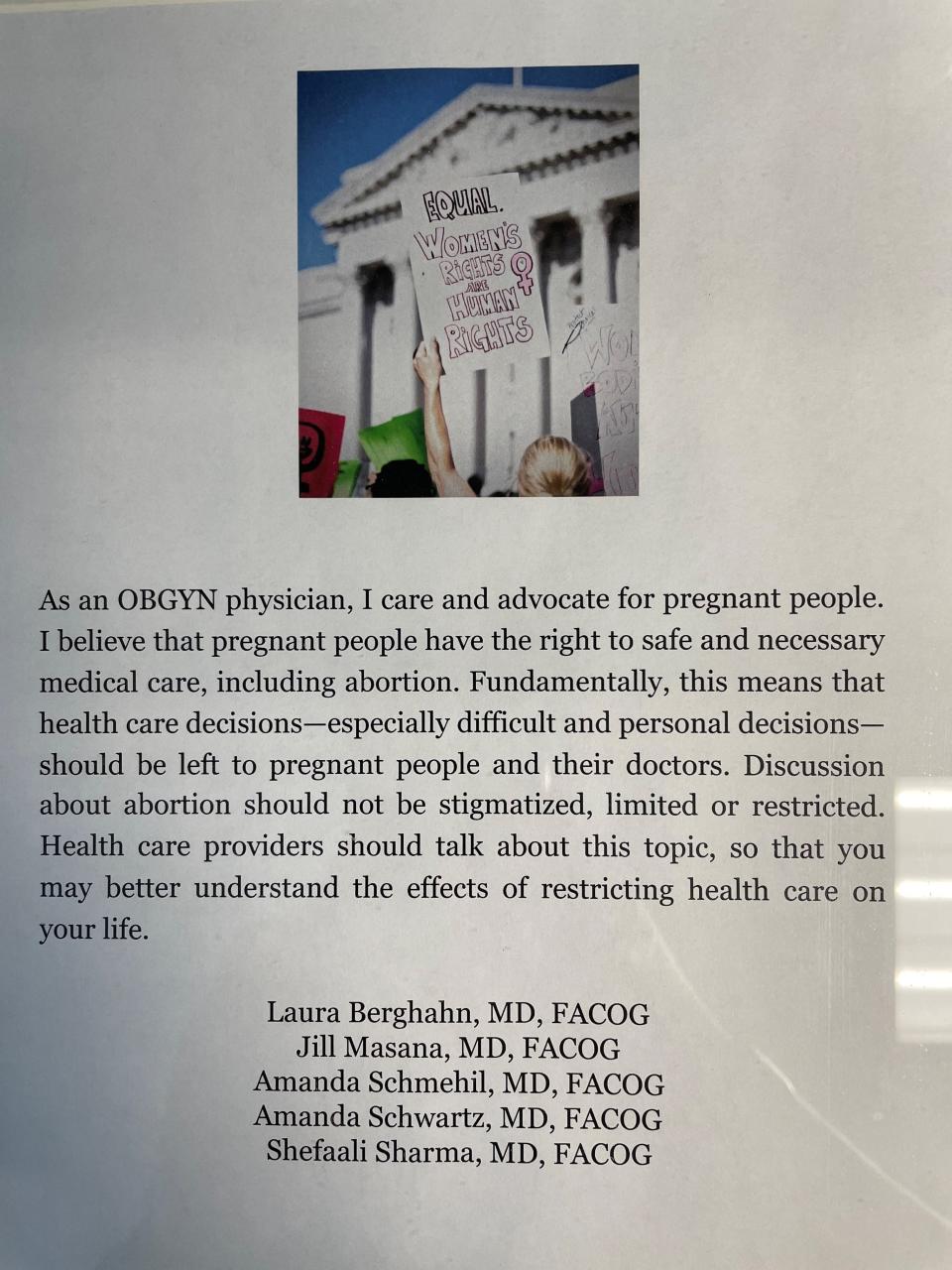 A poster supporting patients' right to abortion services hangs in the clinic where Shefaali Sharma works.