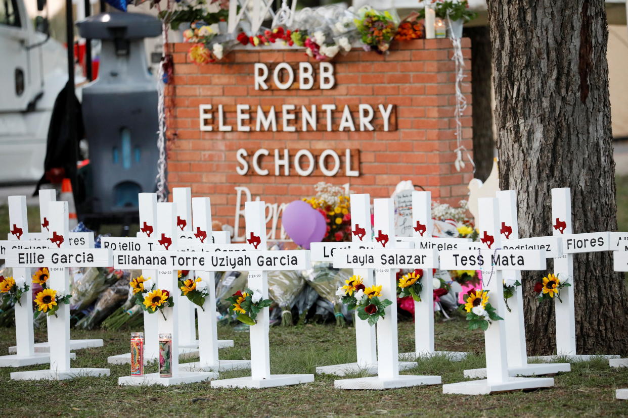 Crosses with the names of victims of the mass shooting are seen at a memorial outside Robb Elementary School in Uvalde, Texas, on Thursday.