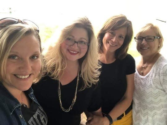 Erika Delange of the Macomb County Chamber of Commerce, Marine City Mayor Jennifer Vandenbossche, Laura Merchant, owner of The Mariner theater, and Lori Thomas, who works at The Mariner, seen here in 2020. The mayor said she has her own secret Popcorn Paradise recipe.