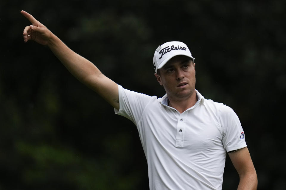 Justin Thomas indicates the direction of his tee shot on the 11th hole during the third round of the Masters golf tournament on Saturday, April 10, 2021, in Augusta, Ga. (AP Photo/Gregory Bull)