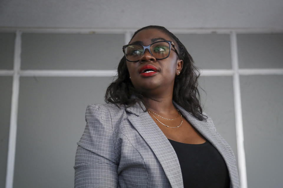 Kenyan senator Gloria Orwoba speaks to the Associated Press at her office in Nairobi, Kenya, Monday, Feb. 27, 2023. Orwoba has said that she attended parliament last month while wearing a white pantsuit stained by her menstruation in order to combat the stigma surrounding women's monthly periods. (AP Photo/Brian Inganga)