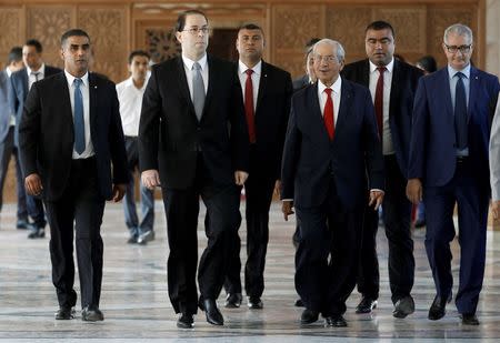 Tunisia's Prime Minister designate Youssef Chahed (front 2nd L) arrives to deliver a speech at the Assembly of People's Representatives in Tunis, Tunisia August 26, 2016. REUTERS/Zoubeir Souissi