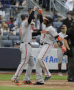 Baltimore Orioles' Tim Beckham, right, celebrates his two-run home run with Trey Mancini during the sixth inning of a baseball game against the New York Yankees at Yankee Stadium, Sunday, Sept. 23, 2018, in New York. (AP Photo/Seth Wenig)