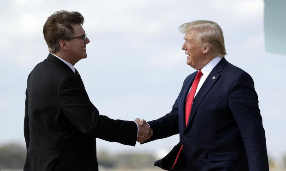 Lieutenant Governor Dan Patrick greets Donald Trump as he arrives in Austin in November 2019. Patrick has aligned himself closely with the former president.