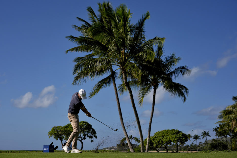 Chris Kirk hits from the 17th tee during the first round of the Sony Open golf event, Thursday, Jan. 11, 2024, at Waialae Country Club in Honolulu. (AP Photo/Matt York)