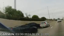 In this screen grab taken from dash camera video provided by Bill Nabors, two speeding sports cars, left and second from left, cause a chain-reaction crash on the North Central Expressway, in Dallas, Saturday, March 30, 2024. Dallas police said Wednesday, April 10, that Kansas City Chiefs' wide receiver Rashee Rice faces charges including aggravated assault after he and another speeding driver of a sports car caused a chain-reaction crash on a Dallas highway. (Bill Nabors via AP)