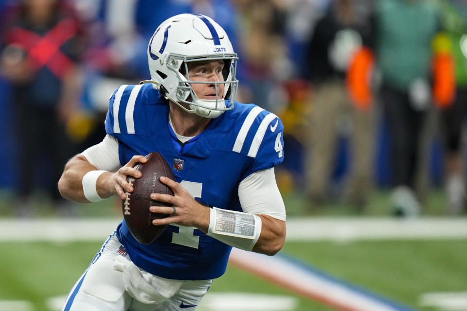 Indianapolis Colts quarterback Sam Ehlinger (4) looks to throw against the Washington Commanders in the first half of an NFL football game in Indianapolis, Sunday, Oct. 30, 2022. (AP Photo/AJ Mast)