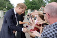 <p>Prince Harry, Duke of Sussex and Meghan, Duchess of Sussex speak with well-wishers at Windsor Castle on Sept. 10, 2022 in England. (Photo by Chris Jackson - WPA Pool/Getty Images)</p> 