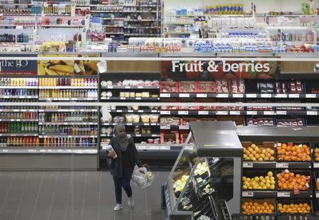 A woman shops at a Sainsbury's store in London, Britain October 11, 2016. REUTERS/Neil Hall