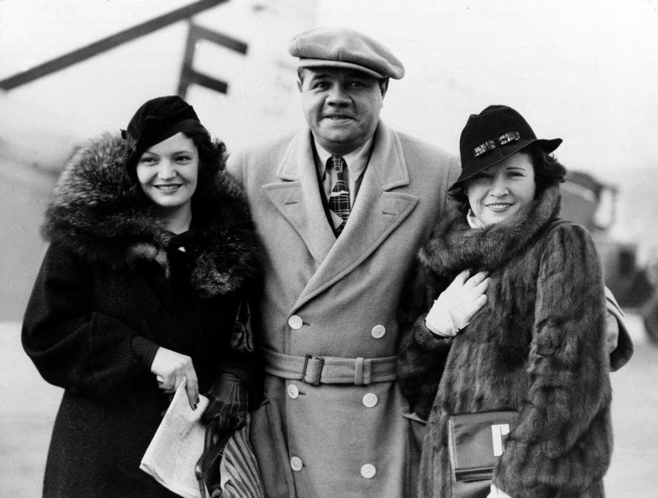 American baseball player Babe Ruth, center, is shown with his wife, Claire Ruth, right, and their daughter Julia after his arrival this afternoon at Croydon airport in London, England in 1935.