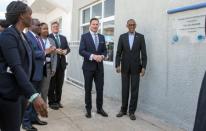 FILE PHOTO: Rwanda's President Paul Kagame and Volkswagen's South Africa boss Thomas Schaefer unveil the plaque of Volkswagen's new factory in Kigali