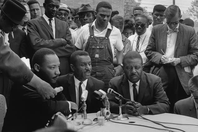 <p>Chris McNair/Getty </p> Civil Rights leaders Rev. Martin Luther King Jr., Rev. Fred L. Shuttlesworth, Andrew Young (in dungarees) and Rev. Ralph David Abernathy hold a news conference at the A.G. Gaston Motel following their release from the Birmingham city jail on April 16, 1963 in Birmingham, Alabama.