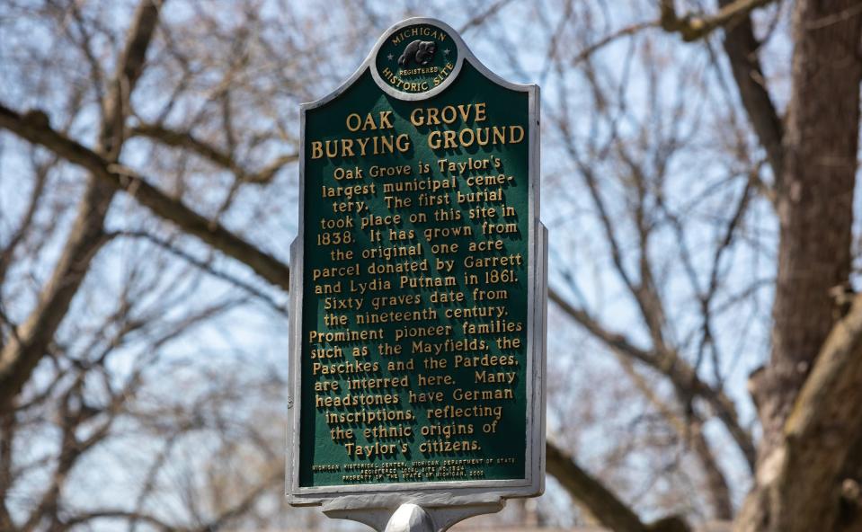 A sign marking the location as a historic site at the Oak Grove Burying Ground in Taylor on Wednesday, April 12, 2023.