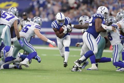 Indianapolis Colts' Marlon Mack (25) runs against Dallas Cowboys' Leighton Vander Esch (55) during the second half of an NFL football game - Credit: AP Photo/Michael Conroy