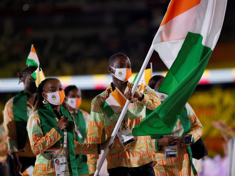 Athletes from Cote d'Ivoire make their entrance at the Summer Olympics.