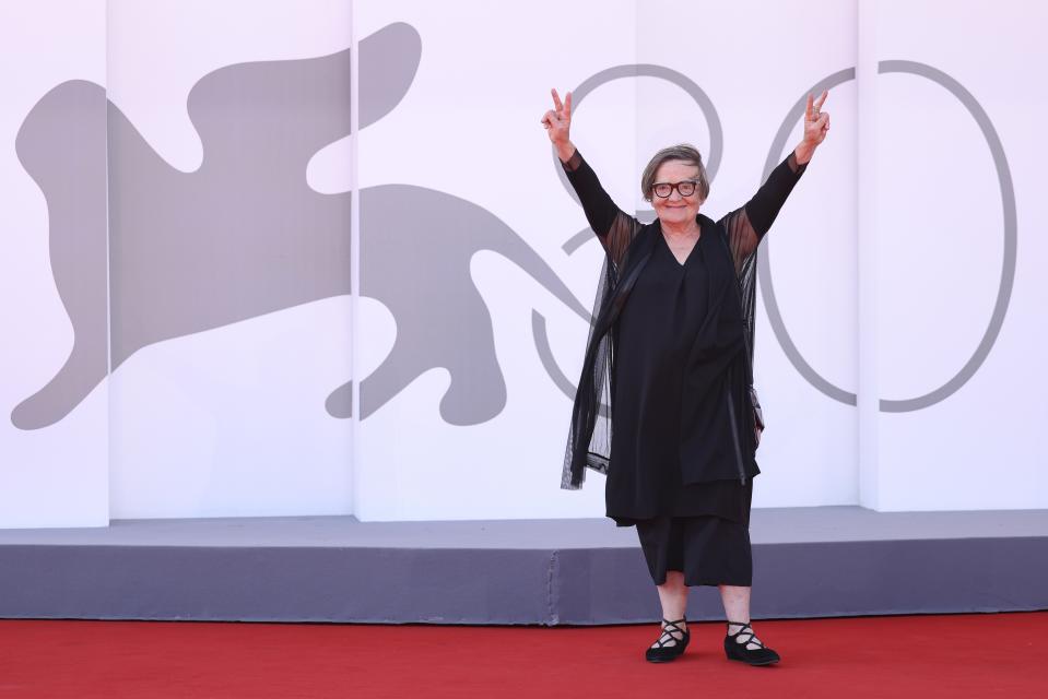 Director Agnieszka Holland gestures peace signs as she poses for photographers upon arrival for the premiere of the film 'Green Border' during the 80th edition of the Venice Film Festival in Venice, Italy, on Tuesday, Sept. 5, 2023. (Photo by Vianney Le Caer/Invision/AP)