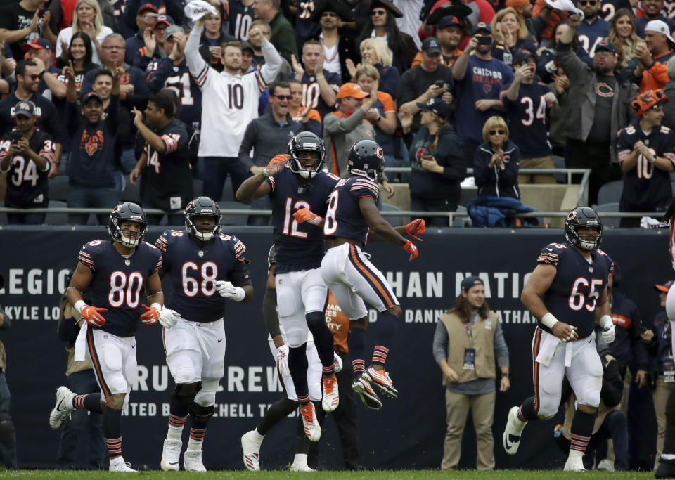 Chicago Bears wide receiver Allen Robinson (12) celebrates after catching a touchdown pass during the first half of an NFL football game against the Tampa Bay Buccaneers Sunday, Sept. 30, 2018, in Chicago. (AP Photo/Nam Y. Huh)