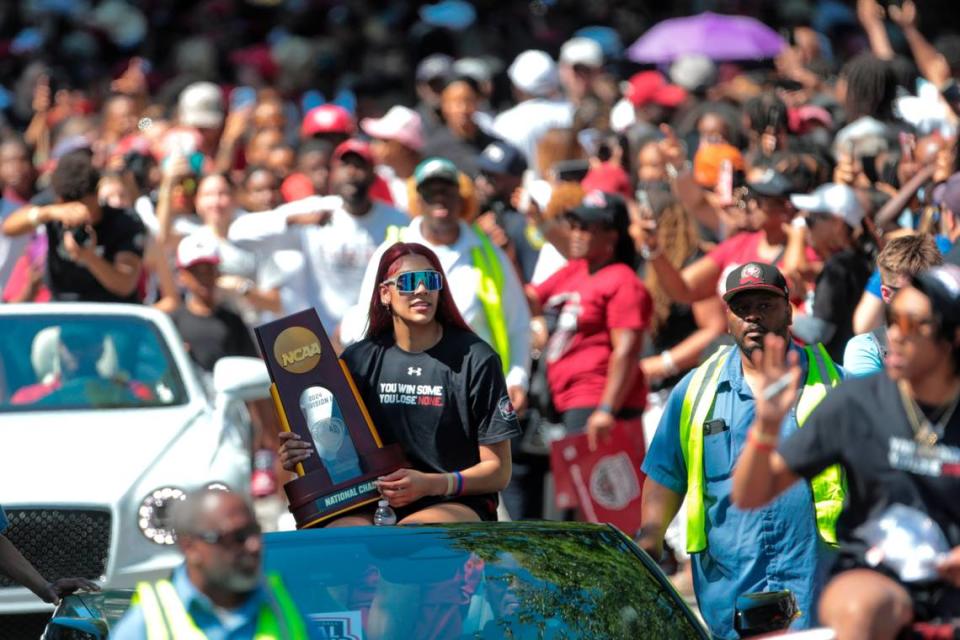 South Carolina’s Kamilla Cardoso rides with the National Championship trophy during a parade through downtown Columbia and a ceremony at the South Carolina State House on Sunday, April 14, 2024. The Gamecocks women’s basketball team won the National Championship after having an undefeated season.