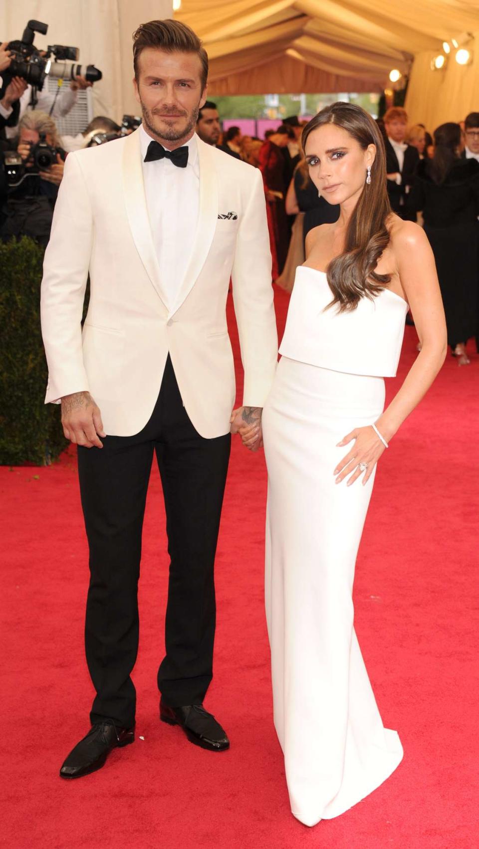 David Beckham and Victoria Beckham attend the "Charles James: Beyond Fashion" Costume Institute Gala at the Metropolitan Museum of Art on May 5, 2014 in New York City