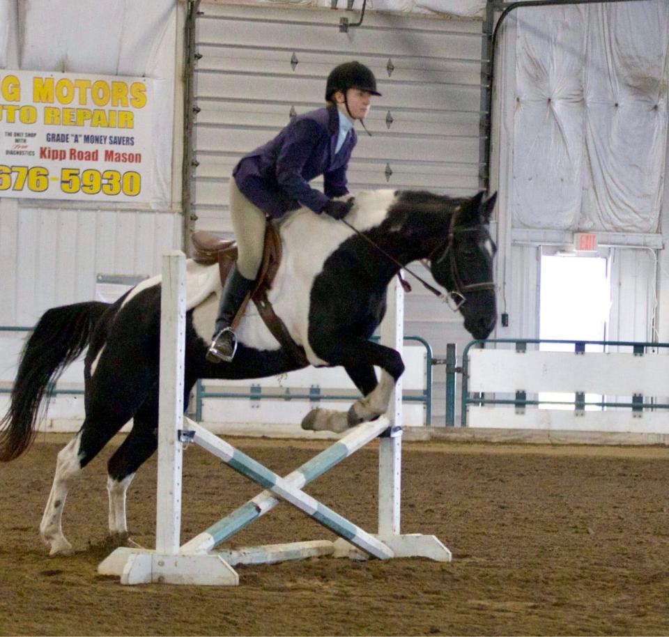 Tecumseh senior Hailey Cheasick takes her horse over a gate during an event during the 2021 season.