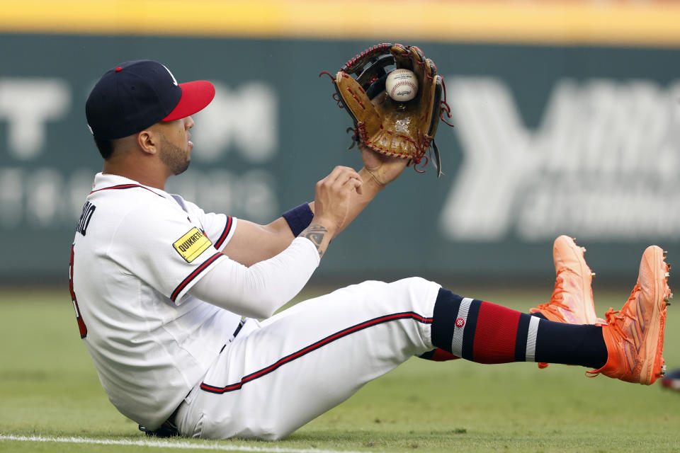 Atlanta Braves left fielder Eddie Rosario catches a fly ball for the out on New York Mets' Brandon Nimmo during the first inning of a baseball game, Tuesday, Aug. 22, 2023, in Atlanta. (AP Photo/Butch Dill)