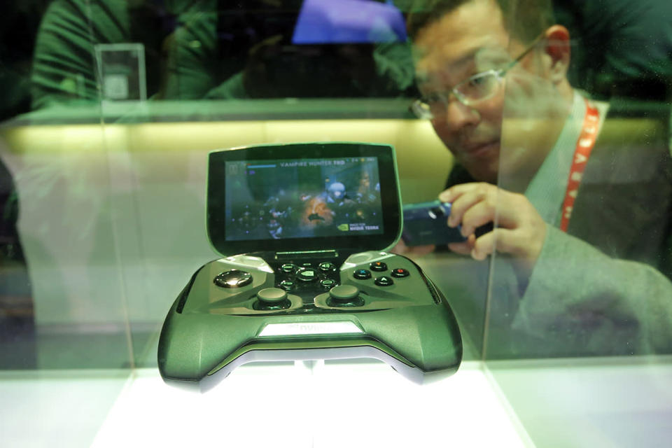 NVIDIA's portable handheld gaming device, the Project Shield, is on display at the NVIDIA booth at the International Consumer Electronics Show.