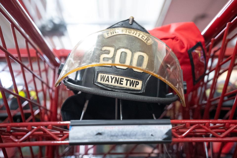 A helmet rests on a storage rack at the Wayne Township Fire Department, a volunteer department in Good Hope, Ohio, in Fayette County.