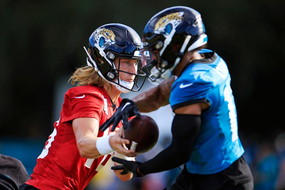Jacksonville Jaguars quarterback Trevor Lawrence (16) hands off to wide receiver Christian Kirk (13) during day 2 of the Jaguars Training Camp Tuesday, July 26, 2022 at the Knight Sports Complex at Episcopal School of Jacksonville.