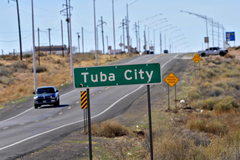 Motorists travel on U.S. 160, Monday, March 4, 2024, in Tuba City, Ariz. This stretch of highway is the de facto border between the Navajo and Hopi Indian reservations and two time zones. Mind-bending time calculations is what people in the largest Native American reservation in the U.S. have to endure every March through November. The Navajo Nation, which stretches into Utah and New Mexico, will reset clocks for one hour later despite the rest of Arizona remaining on standard time. (AP Photo/Matt York)