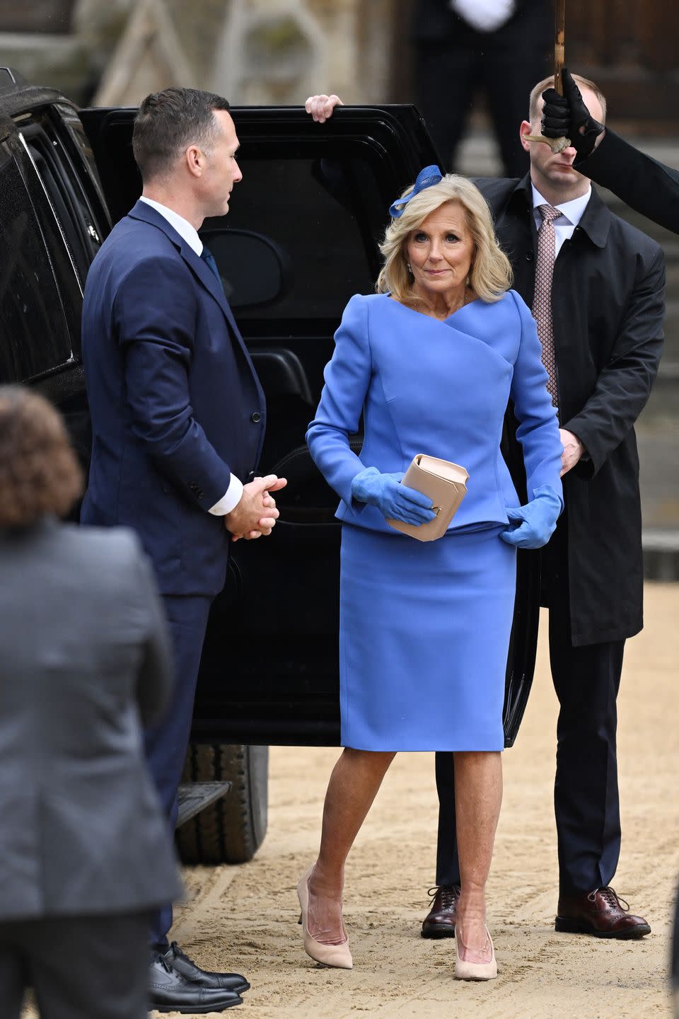 first lady jill biden attends the coronation of king charles iii and queen camilla wearing a blue two piece skirt suit