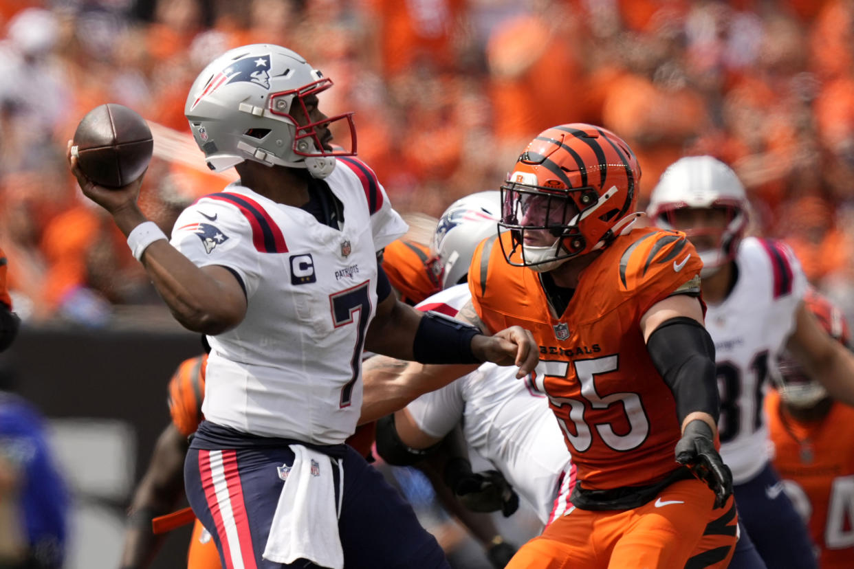 New England Patriots quarterback Jacoby Brissett (7) passes over Cincinnati Bengals linebacker Logan Wilson (55) during the second half of an NFL football game, Sunday, Sept. 8, 2024, in Cincinnati. (AP Photo/Carolyn Kaster)