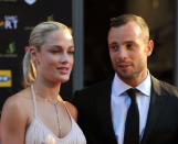 <p>Reeva Steenkamp and Oscar Pistorius. Steenkamp was fatally shot at Pistorius's home near Pretoria, South Africa (Rex Features)</p>